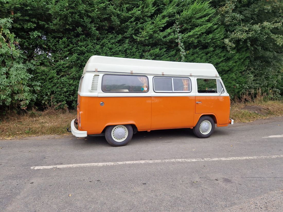 Orange and cream bay window camper